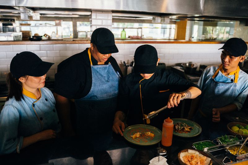 Pizza inn team members working together in the kitchen